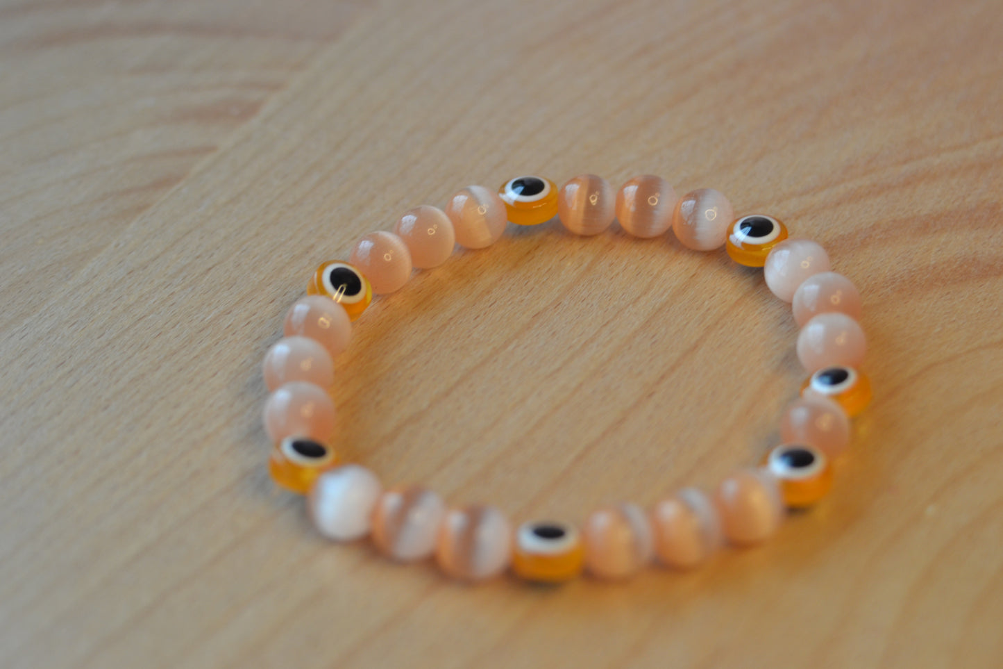 Light Orange Cat’s Eye & Evil Eye Bracelet – Soft Power & Spiritual Protection
