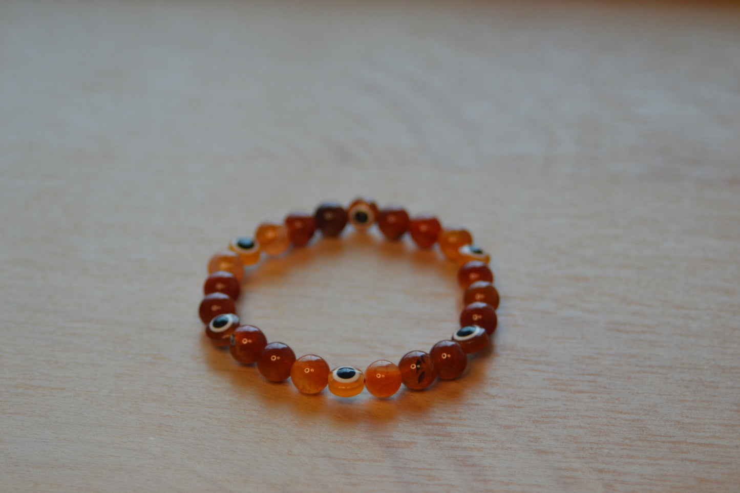 Fire Agate & Evil Eye Bracelet – Protection, Confidence & Bold Solar Energy
