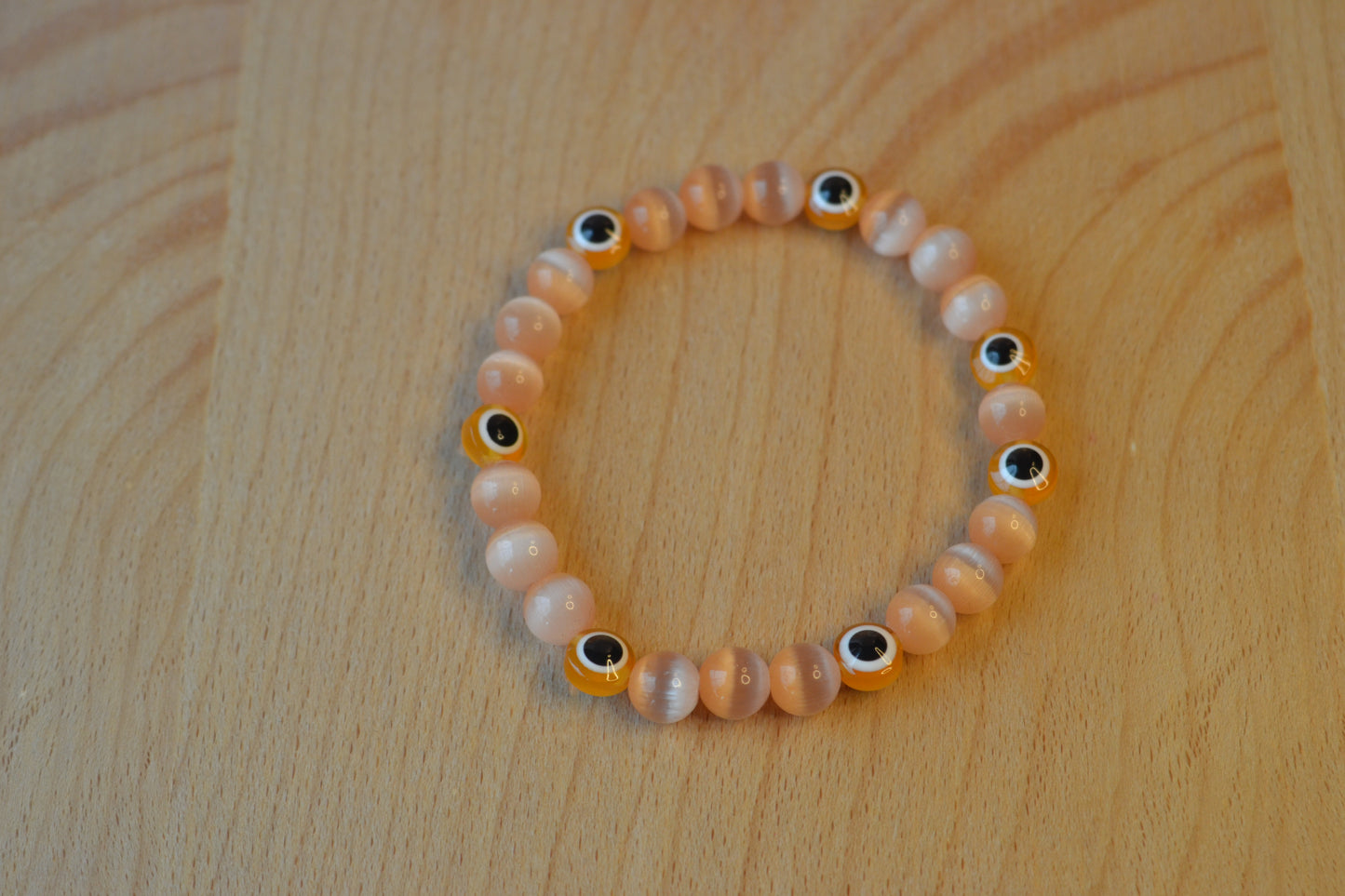 Light Orange Cat’s Eye & Evil Eye Bracelet – Soft Power & Spiritual Protection