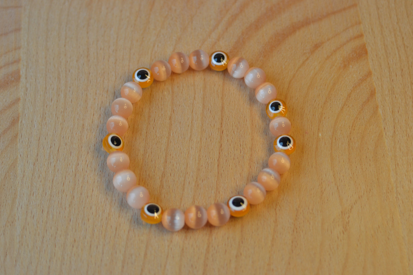 Light Orange Cat’s Eye & Evil Eye Bracelet – Soft Power & Spiritual Protection